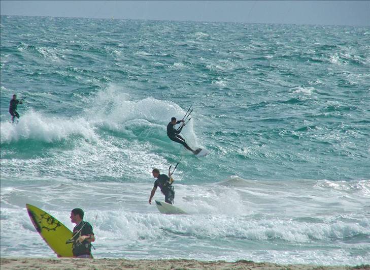 Kitesurfer running a safety check before launch